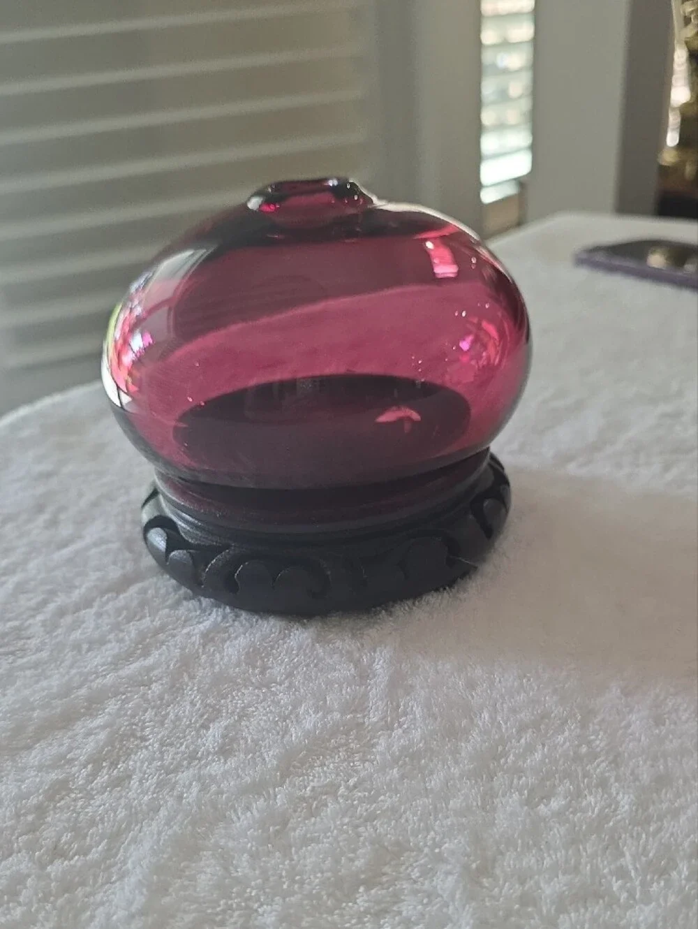Decorative Ruby Red Glass Globe on Carved Wood Base